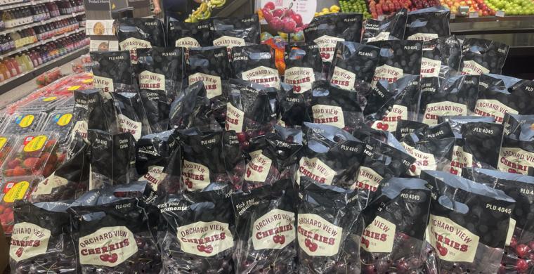 Display of cherries with custom POS