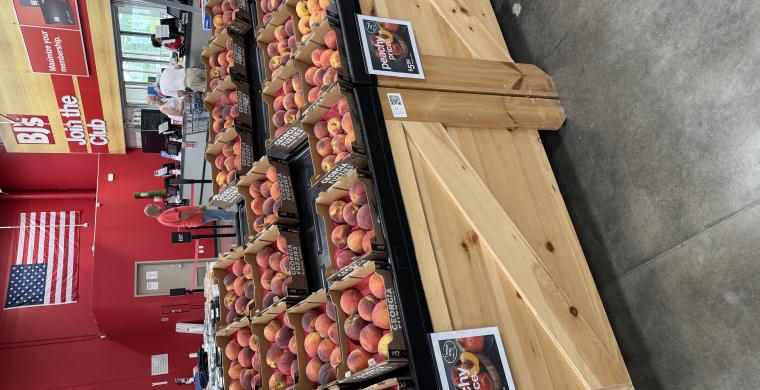 Display of Georgia peaches at entrance to club